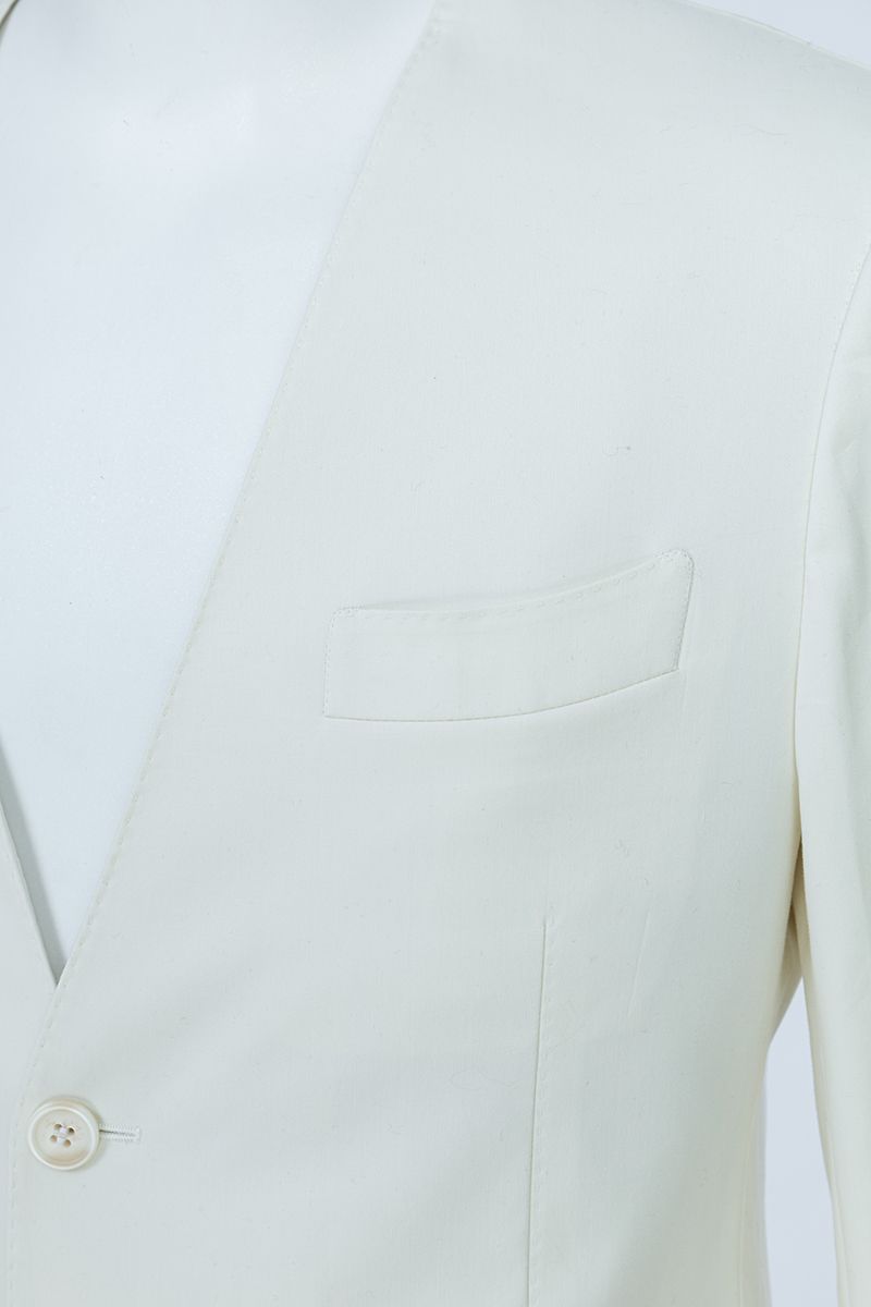 Side profile view of the Salvatore Ivory Peak Lapel Blazer in premium stretch cotton, a made-to-order men's ivory blazer shipped nationwide by Zane.