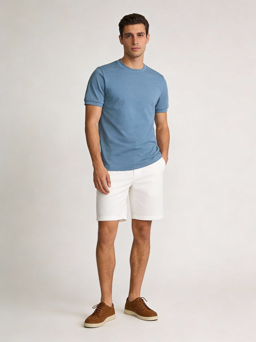 Man wearing blue 100% cotton made to order crew neck tee, shipped nationwide by Zane