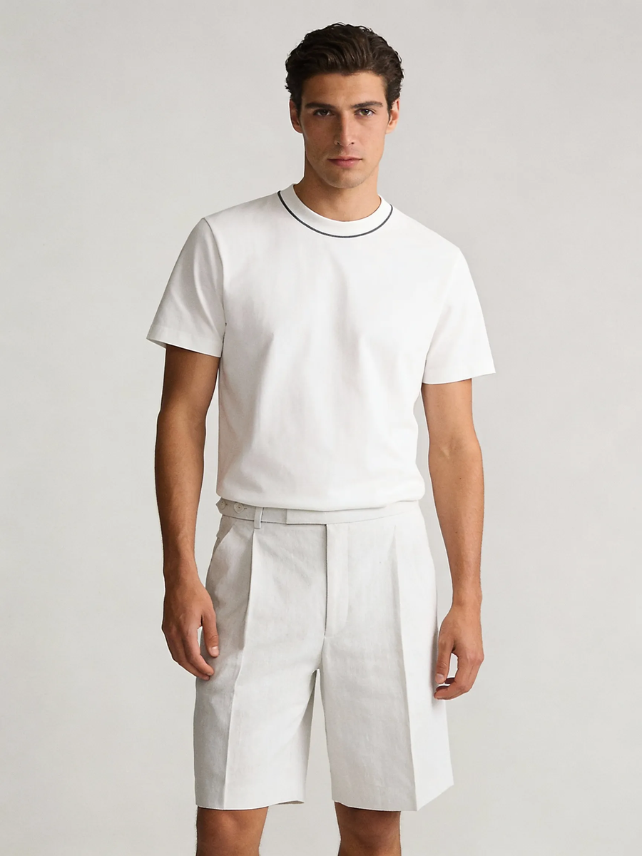 Man wearing white 100% cotton made to order crew neck tee with navy tipped collar, shipped nationwide by Zane