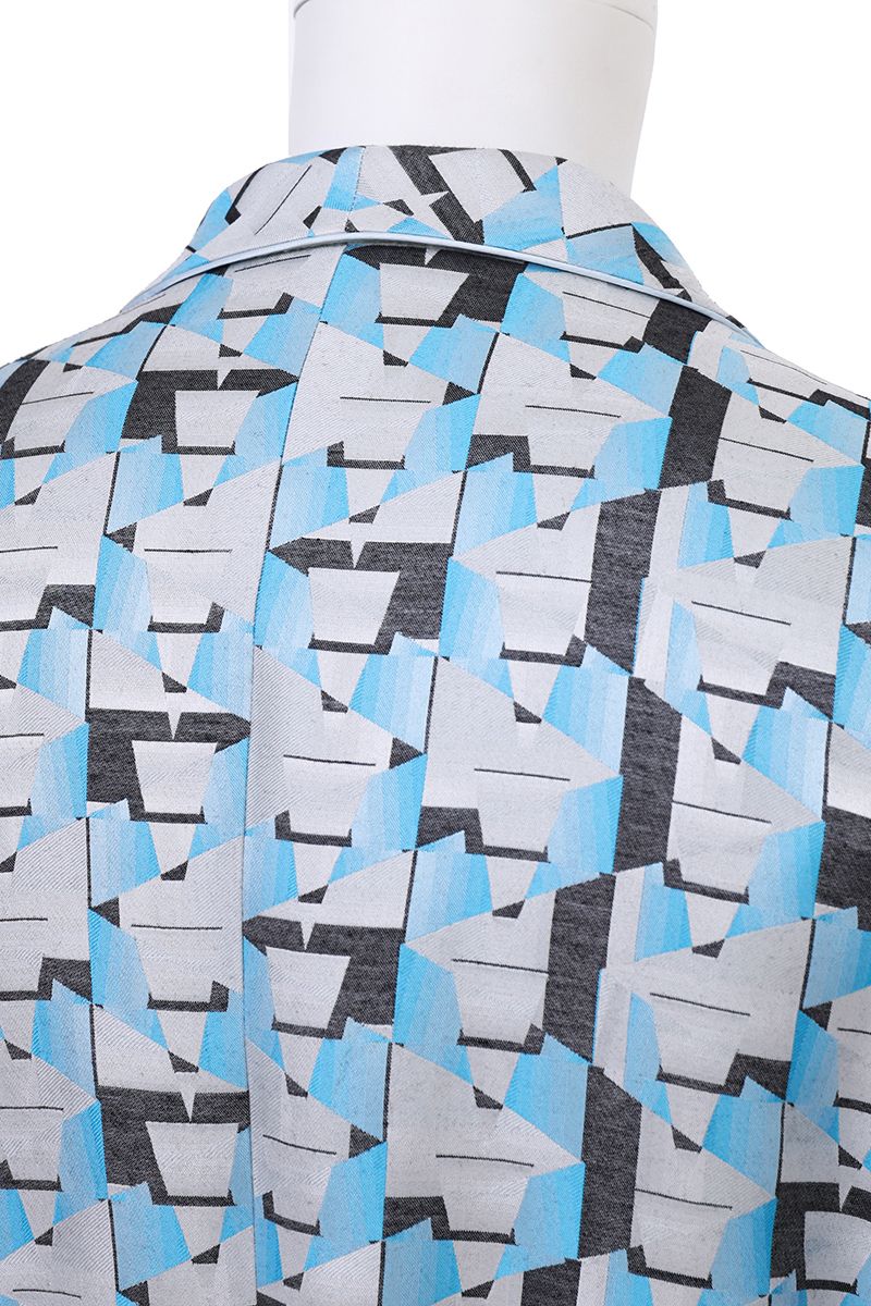 Shawl collar and belt detail of the Vittorio Light Blue Geometric Belted Jacket, a made-to-order men's statement jacket, tailored to your measurements and shipped nationwide by Zane.