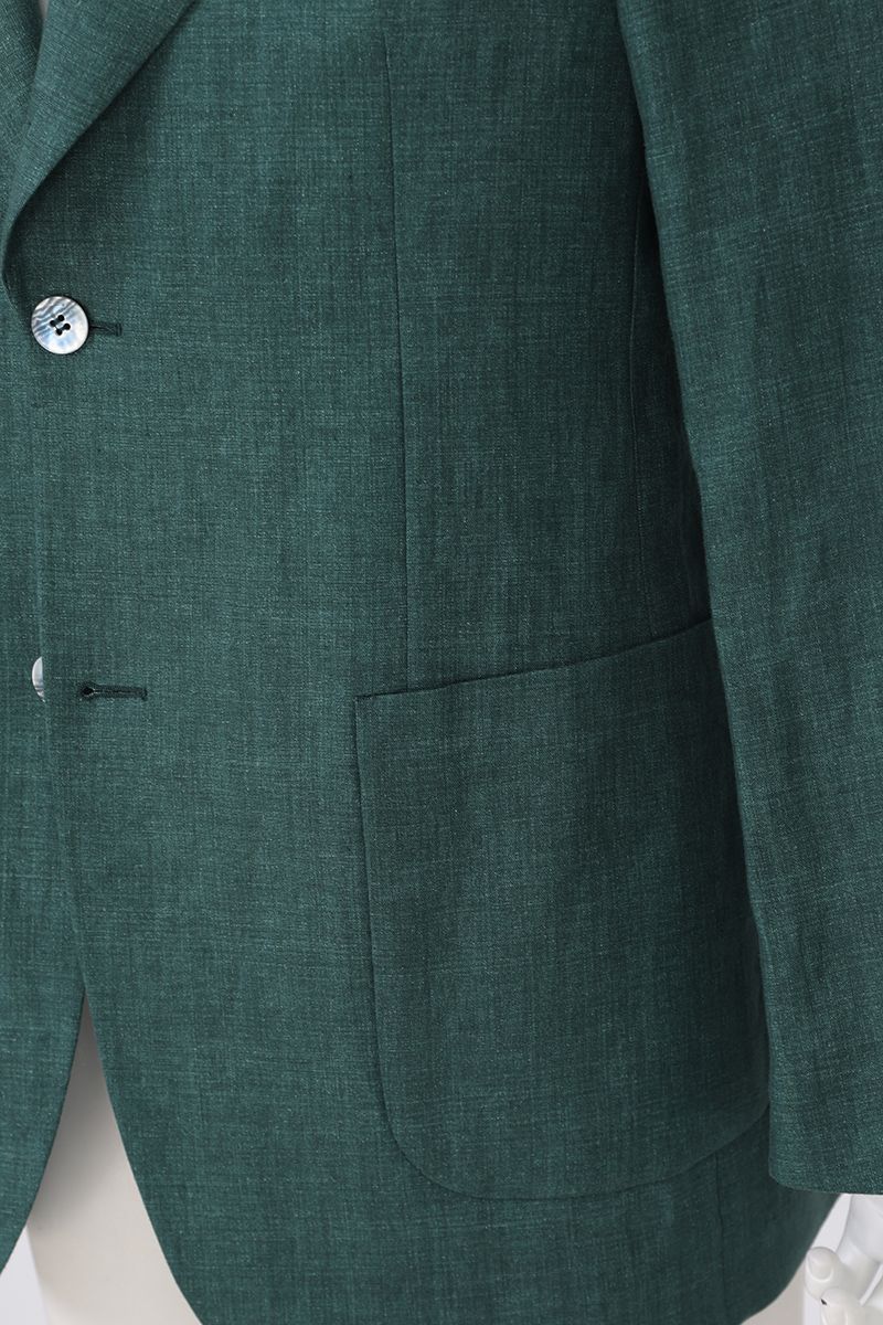 Chest and lapel detail of the Fabio Pine Green Linen Sport Coat, a made-to-order men's notch lapel jacket in 100% Italian Guabello linen, tailored to your measurements and shipped nationwide by Zane.