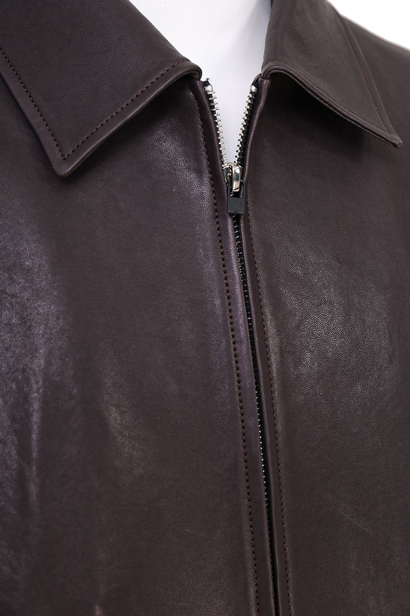 Aubergine leather blouson jacket leather surface close up
