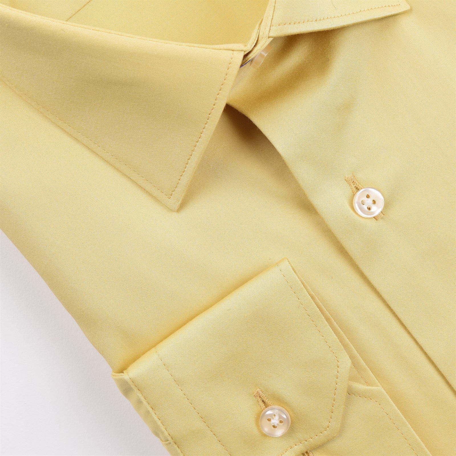A yellow slim fit shirt with long sleeves, featuring a pointelle texture and a button-up front. Champagne Italian cutaway slim fit dress shirt mens long sleeve cotton formal shirt Jacksonville formalwear Zane Suits and Tuxedos