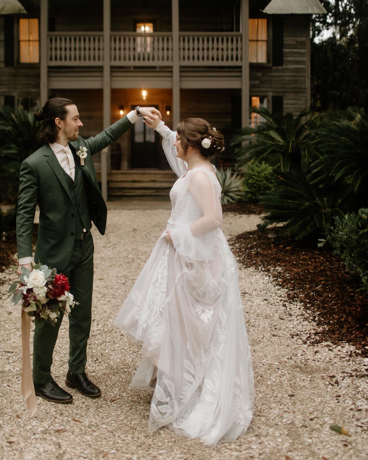 Groom wearing a custom dark green 3-piece wedding suit at a Florida outdoor wedding by Zane Fashion Jacksonville