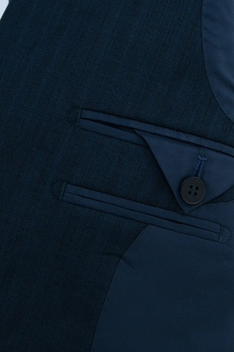 Close-up of a navy blue suit with a button detail custom suits for prom and for business jacksonville fl orlando and miami and tampa