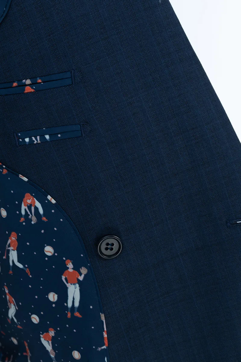 Close-up of a navy blue suit jacket with a button and a patterned sleeve.