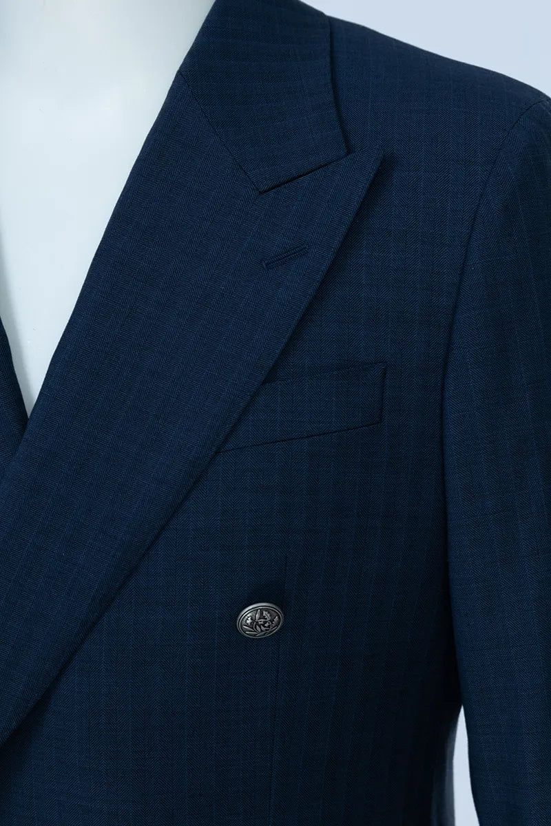 Navy blue suit jacket on a mannequin with a white background