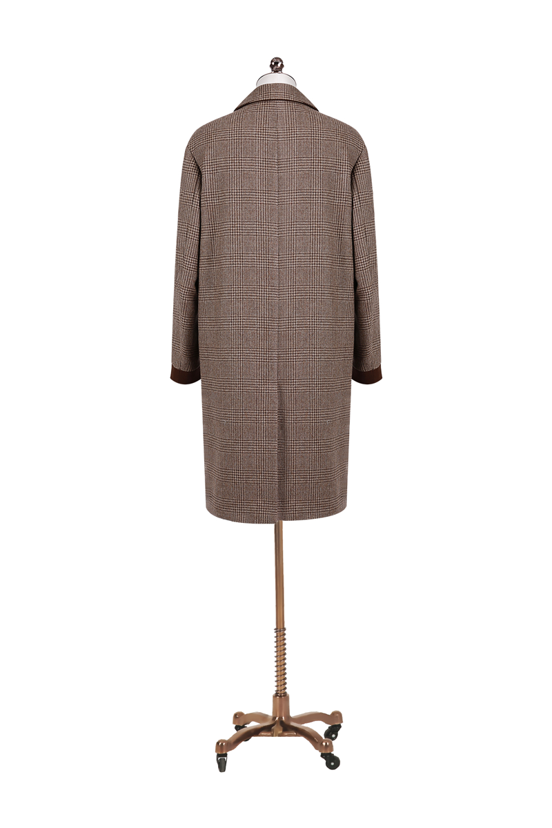 Brown checkered coat on a mannequin against a white background