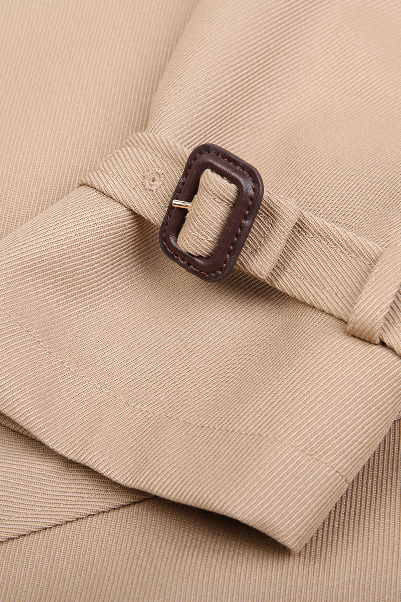 Close-up of a beige fabric with a brown buckle