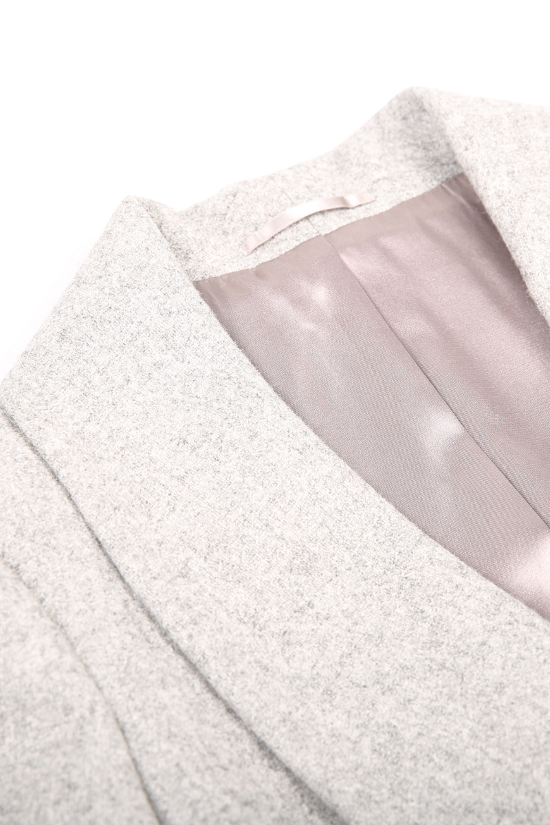 Close-up of a textured fabric with a pink lining