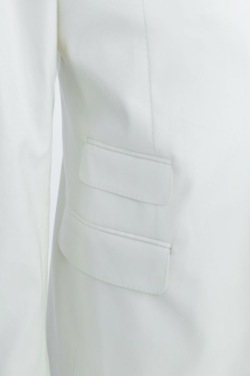 Fabric and tailoring close-up of the Salvatore Ivory Peak Lapel Blazer, showing the smooth premium stretch cotton in ivory, made to order and shipped nationwide by Zane.