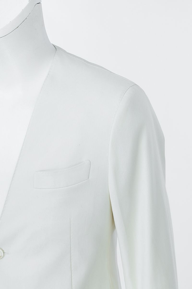 Three-quarter angle of the Salvatore Ivory Peak Lapel Blazer in premium stretch cotton, a made-to-order men's ivory wedding blazer, shipped nationwide by Zane.