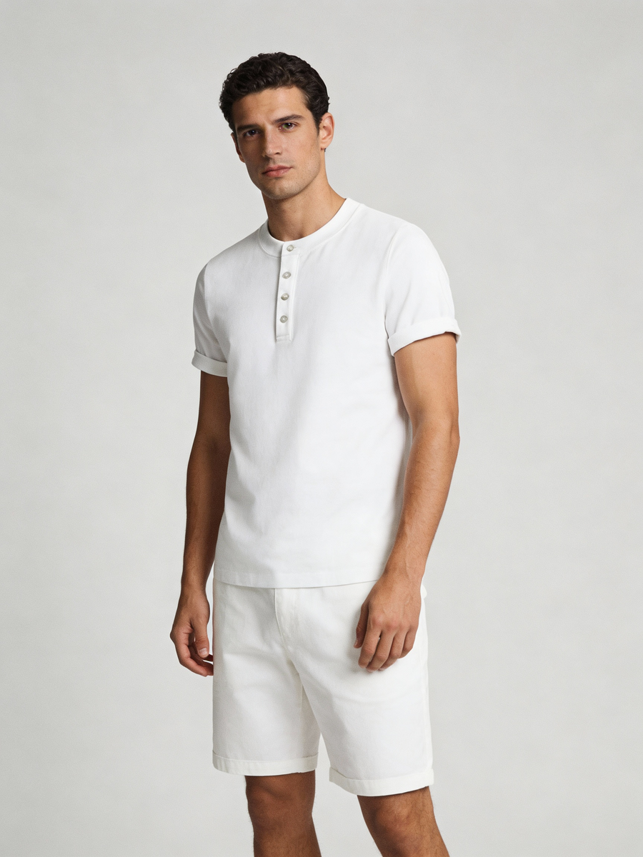 Man wearing white 100% cotton made to order henley with band collar and button placket, shipped nationwide by Zane