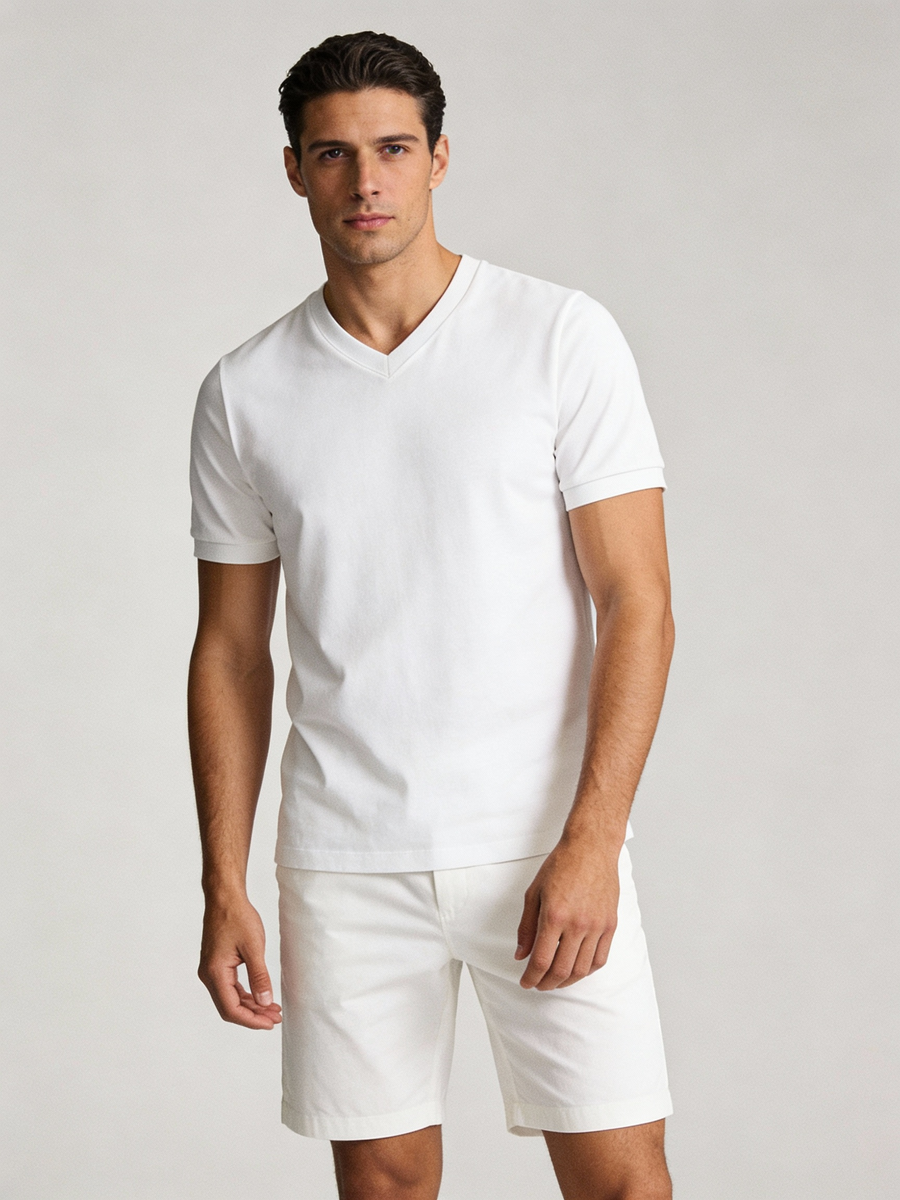 Man wearing white 100% cotton made to order V neck tee, shipped nationwide by Zane