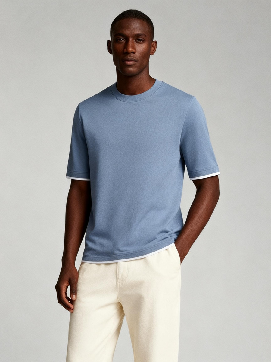 Man wearing dusty blue 100% cotton made to order crew neck tee with white tipping, shipped nationwide by Zane