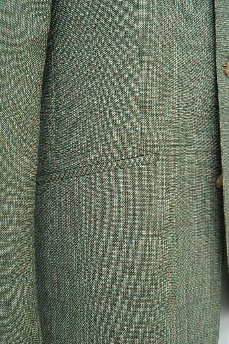 Chest and collar detail of the Marco Sage Green Mandarin Collar Jacket, a made-to-order men's Mandarin collar sport coat in Super 130s Italian REDA wool, tailored to your measurements and shipped nationwide by Zane.