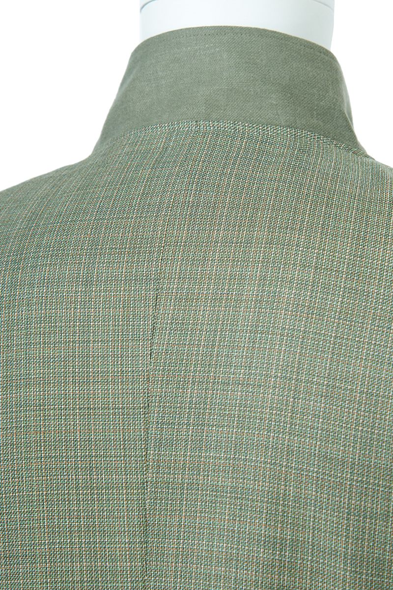 Side profile view of the Marco Sage Green Mandarin Collar Jacket in sage green Super 130s Italian REDA wool, a made-to-order men's jacket shipped nationwide by Zane.