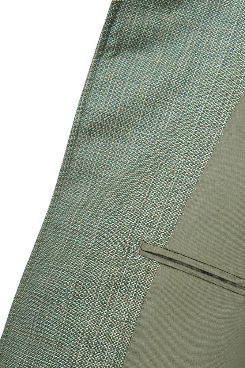 Shoulder and sleeve detail of the Marco Sage Green Mandarin Collar Jacket in Super 130s Italian REDA wool, a made-to-order men's jacket tailored to your measurements and shipped nationwide by Zane.