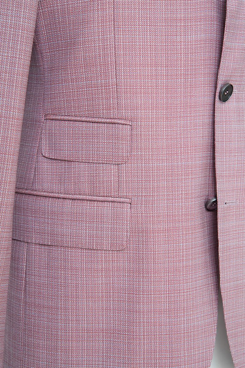 Chest and lapel detail of the Enzo Dusty Pink Sport Coat, a made-to-order men's notch lapel sport coat in Super 130s Italian REDA wool, tailored to your measurements and shipped nationwide by Zane.