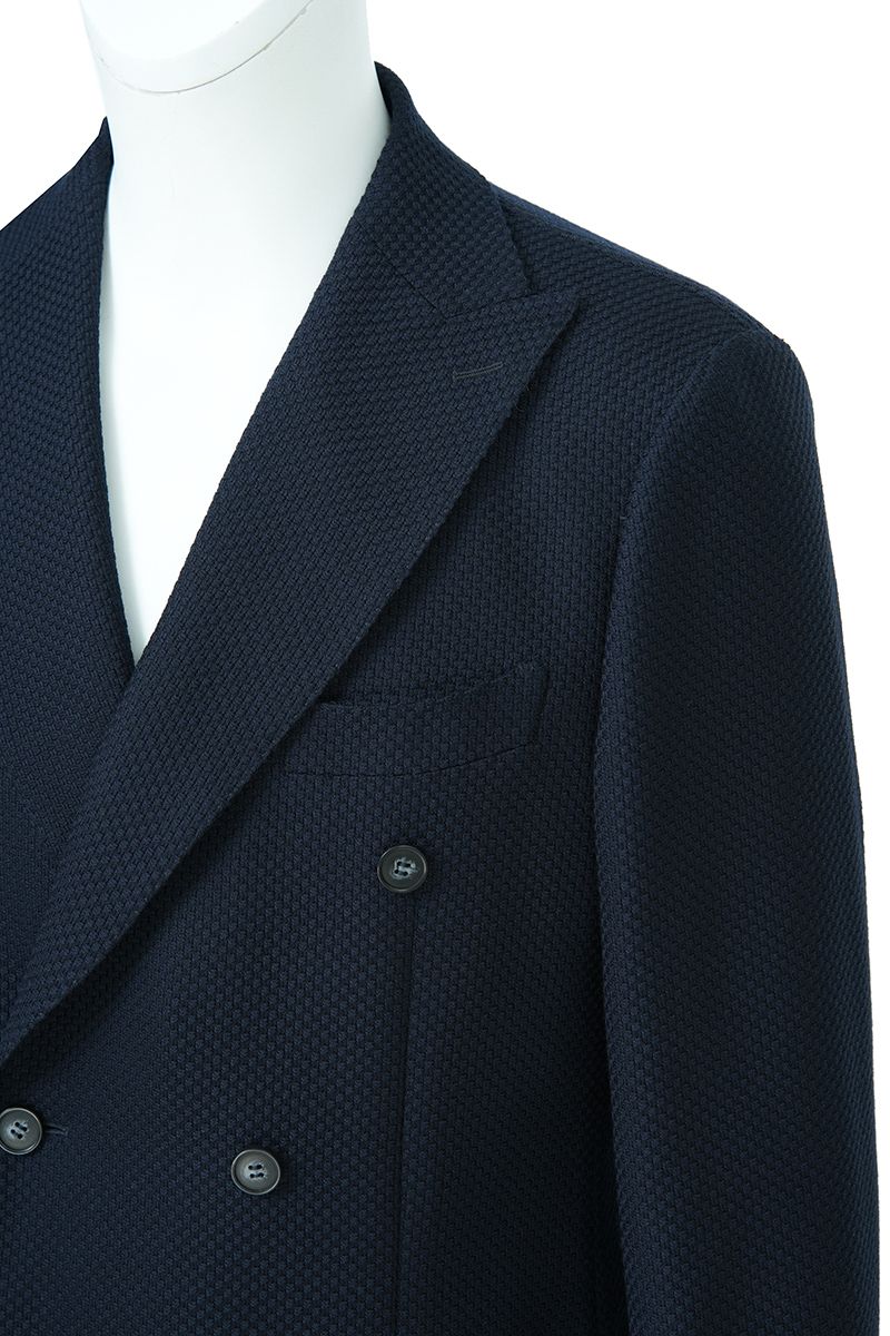 Three-quarter angle of the Luca Navy Double Breasted Sport Coat, a made-to-order men's double-breasted sport coat in navy Italian REDA wool, tailored to your measurements and shipped nationwide by Zane.