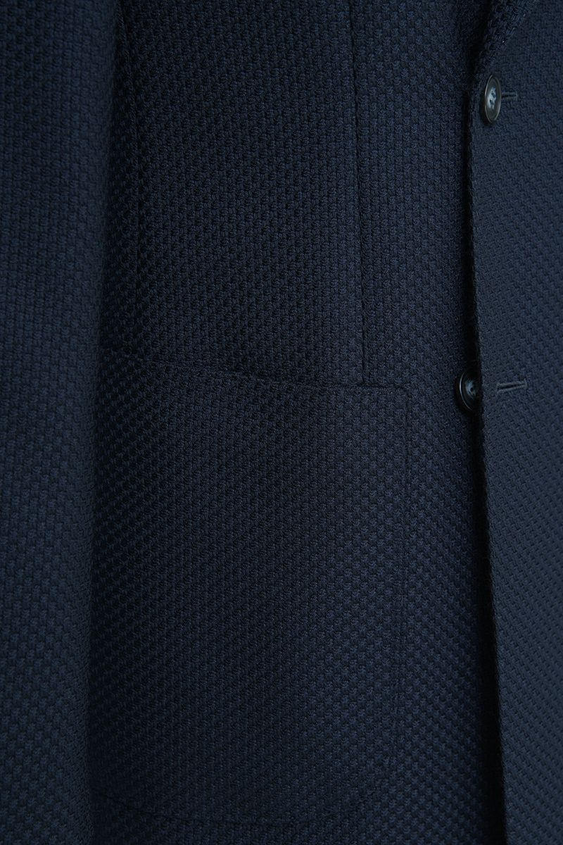 Chest and peak lapel detail of the Luca Navy Double Breasted Sport Coat, a made-to-order men's double-breasted jacket in Italian REDA wool, tailored to your measurements and shipped nationwide by Zane.