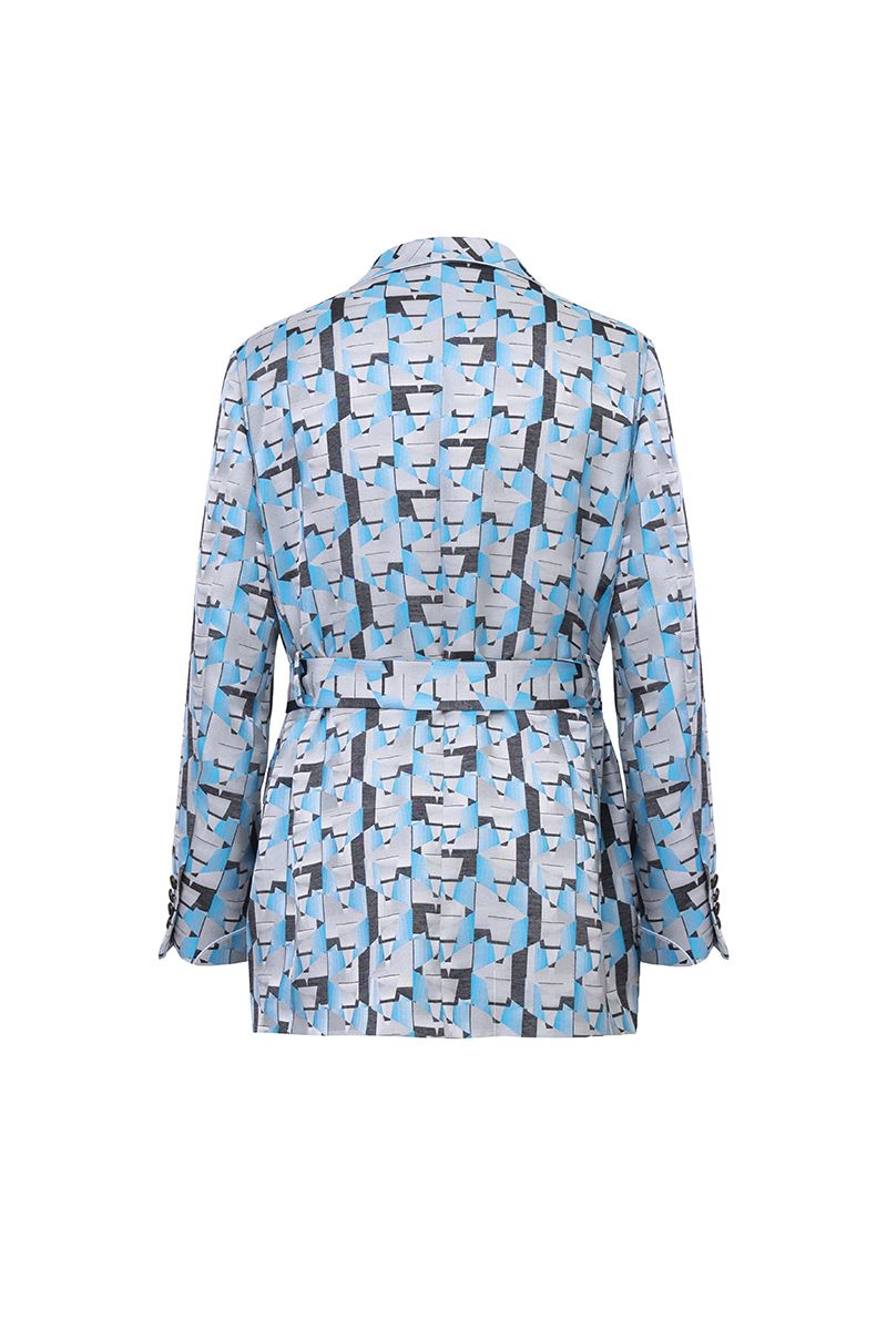 Styled look of the Vittorio Light Blue Geometric Belted Jacket, a made-to-order men's shawl-collar statement piece in a light blue and grey geometric print for evenings and parties, shipped nationwide by Zane.