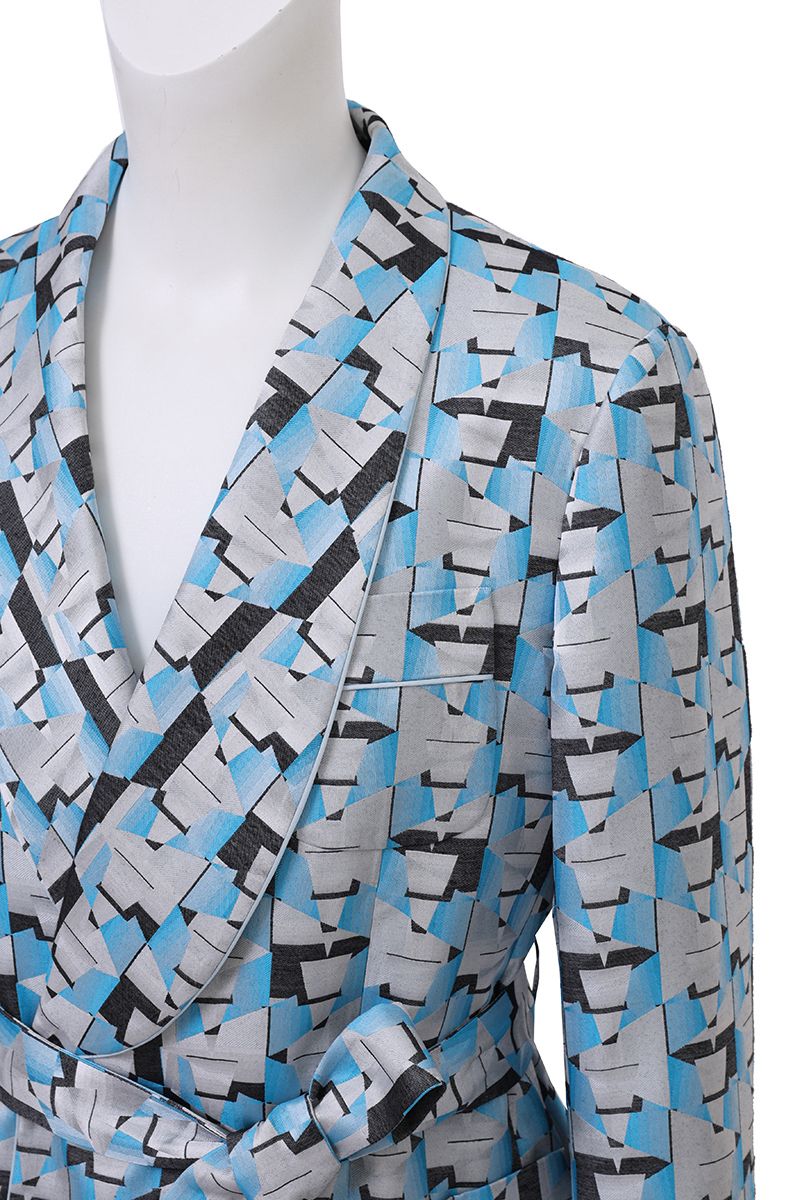 Three-quarter angle of the Vittorio Light Blue Geometric Belted Shawl Collar Jacket, a made-to-order men's statement jacket, tailored to your measurements and shipped nationwide by Zane.
