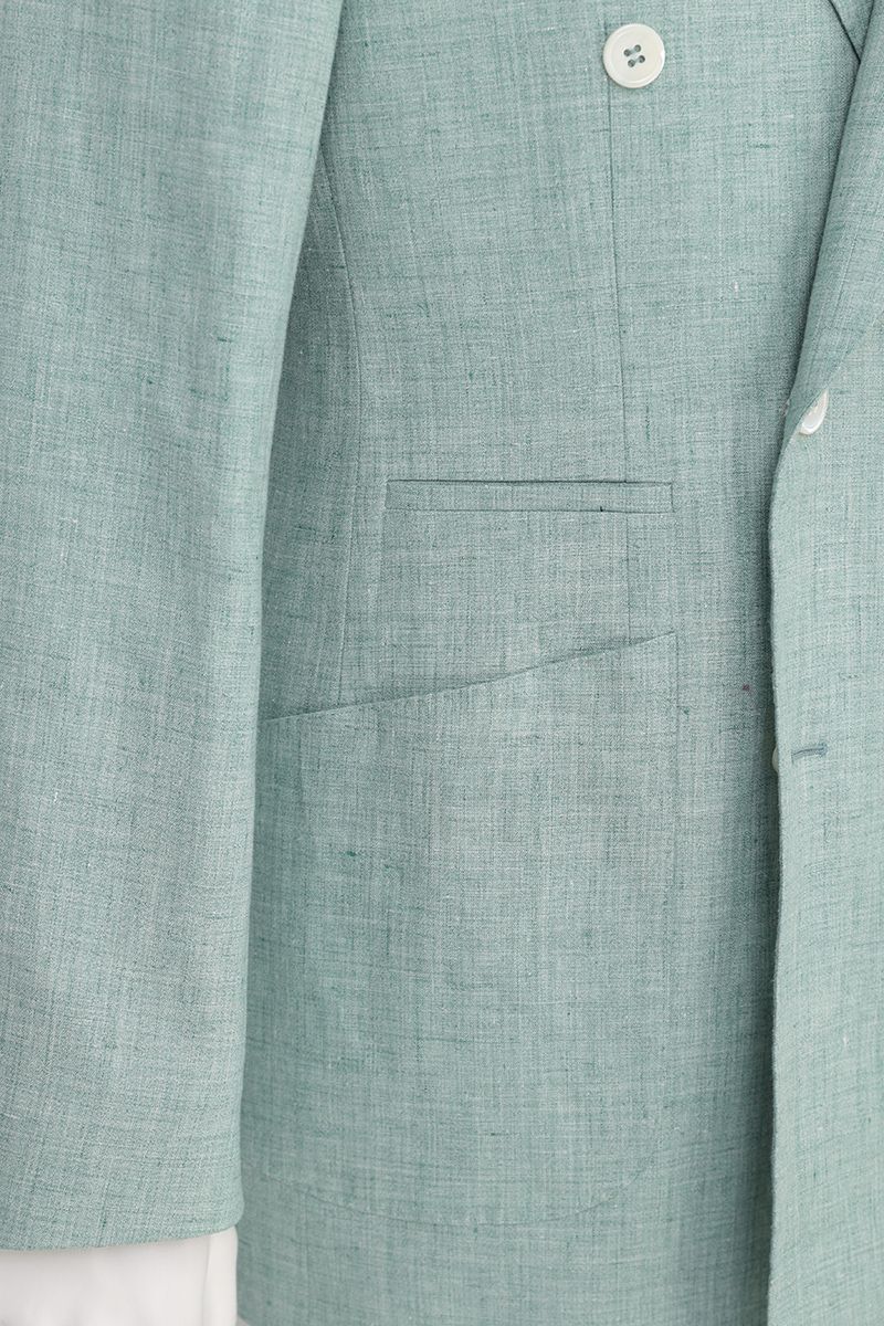 Chest and peak lapel detail of the Nico Sage Green Double Breasted Linen Sport Coat, a made-to-order men's jacket in 100% Italian Guabello linen, shipped nationwide by Zane.