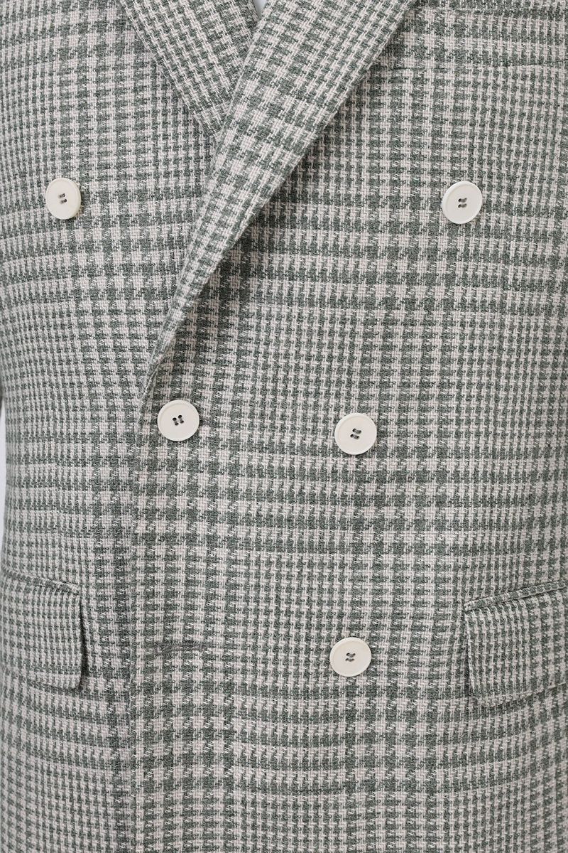 Fabric and tailoring close-up of the Raffaele Grey Glen Plaid Sport Coat, showing the Italian Marzotto cotton and wool blend in a grey Prince of Wales check, made to order and shipped nationwide by Zane.