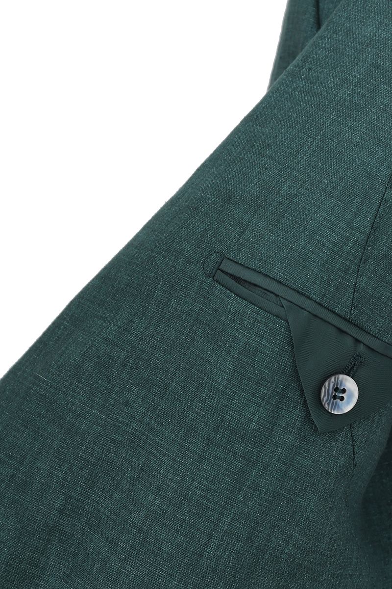 Editorial styling shot of the Fabio Pine Green Linen Sport Coat, a made-to-order men's 100% Italian Guabello linen jacket for summer weddings and events, shipped nationwide by Zane.