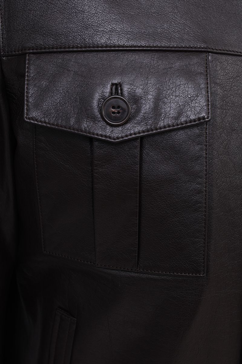 Leather trucker jacket chest pocket flap and button detail