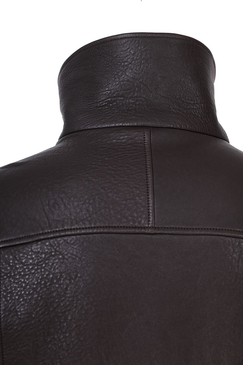Brown leather moto jacket slant welt pocket detail
