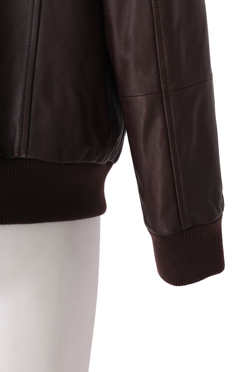 Brown leather flight jacket flap chest pocket detail