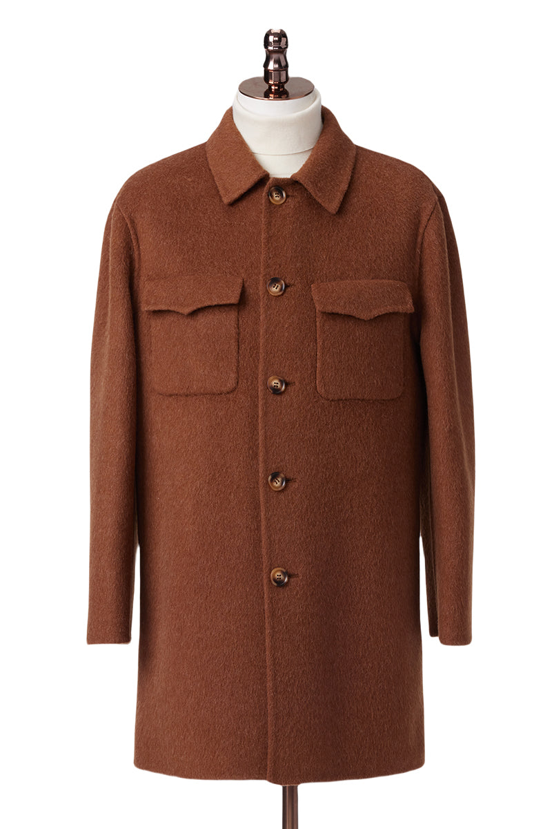 Brown coat on a mannequin against a white background custom made clothing for men and women business wear