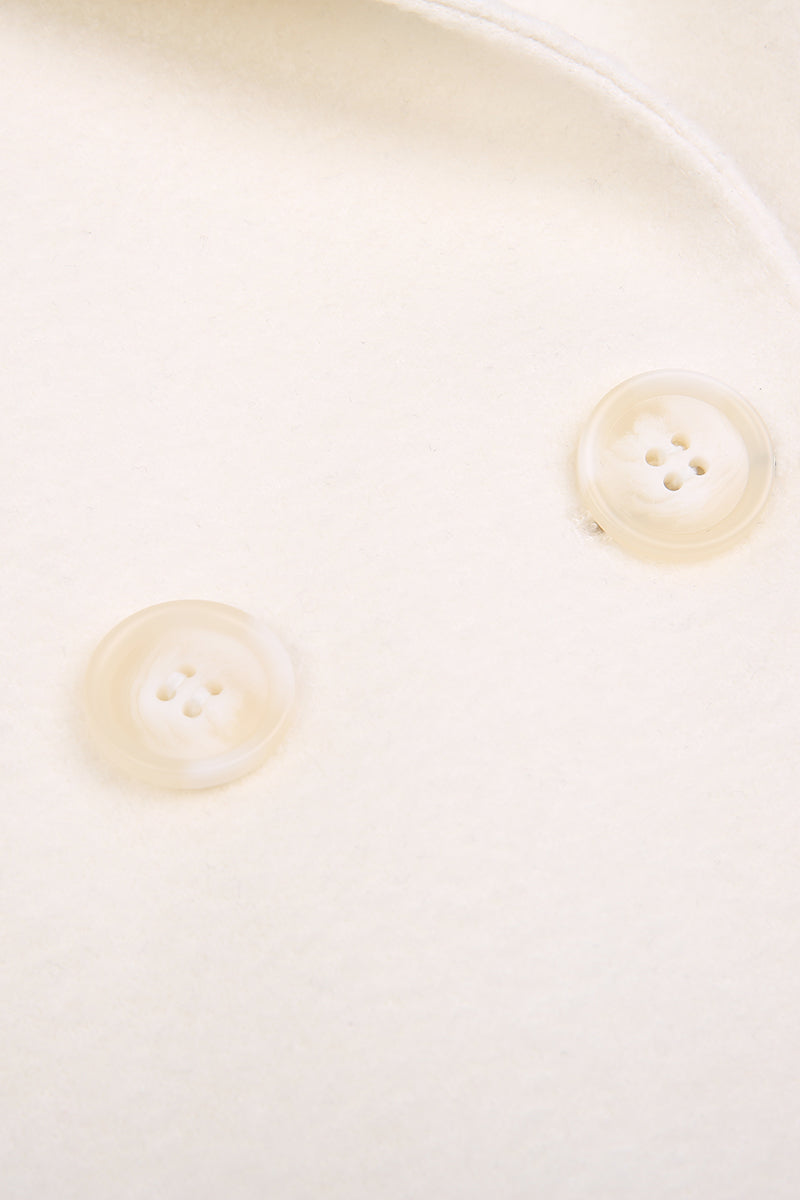 Close-up of two beige buttons on a white background custom made women jacket miami dallas virginia 