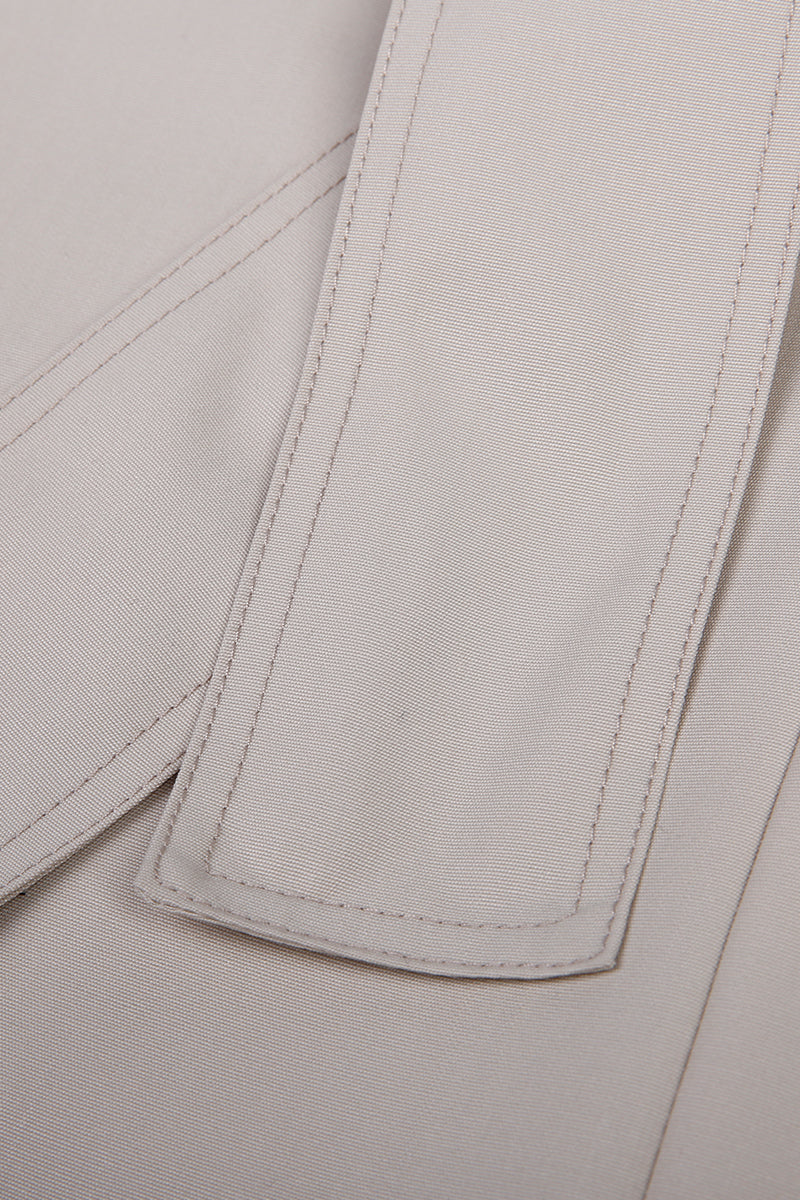 Close-up of a light gray fabric with stitching detail custom suit 