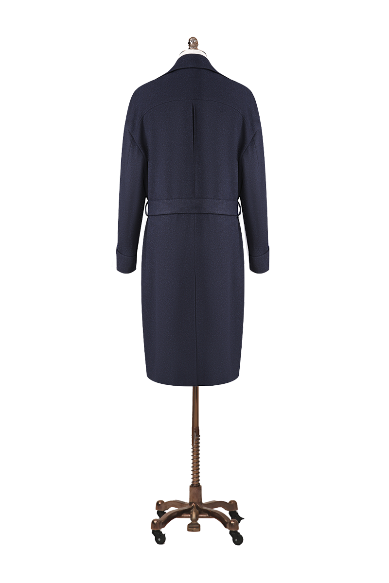 Navy blue coat on a mannequin against a white background