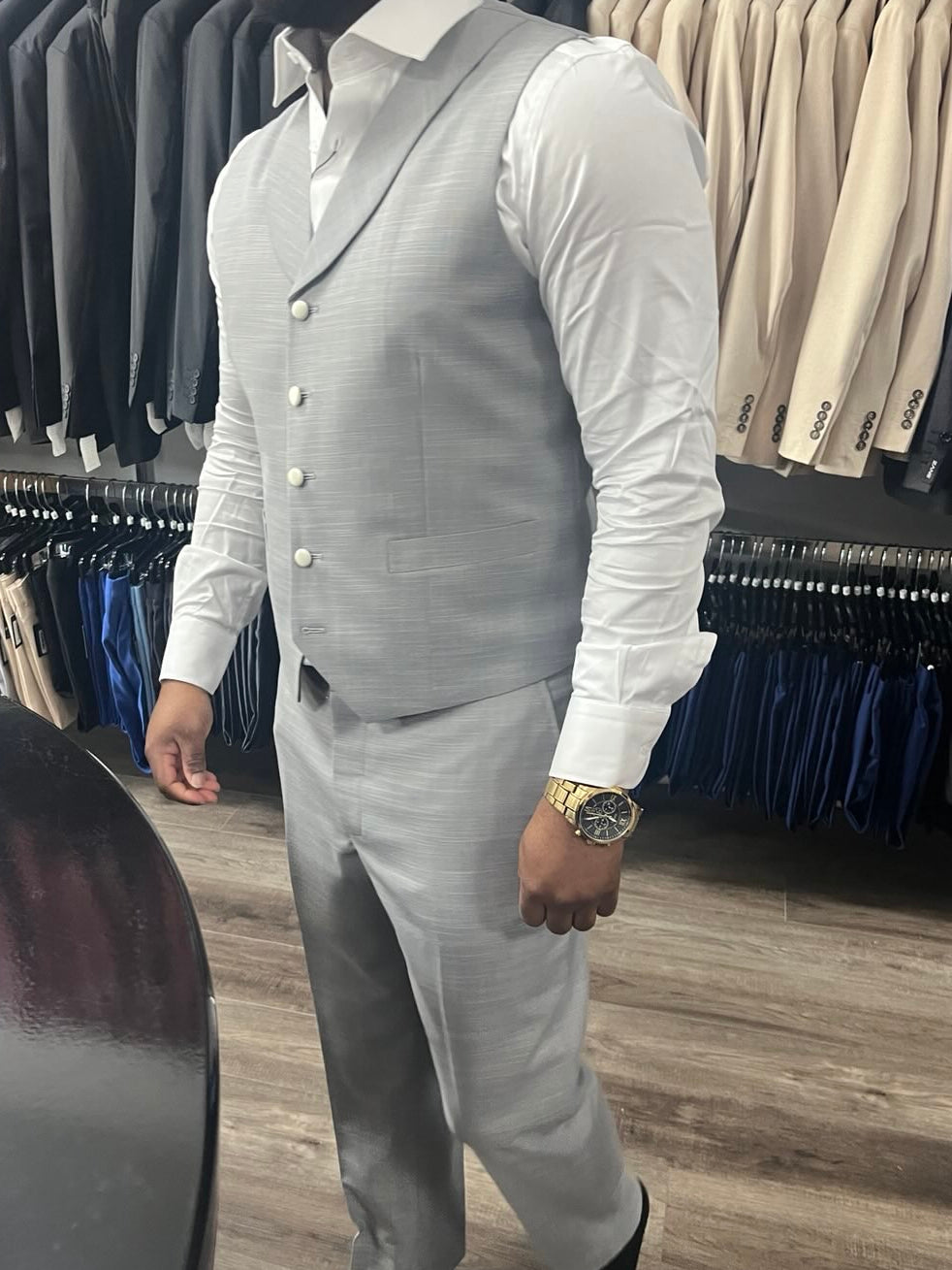Client wearing a custom fitted 3-piece gray suit at Zane Fashion tailoring shop in Jacksonville FL