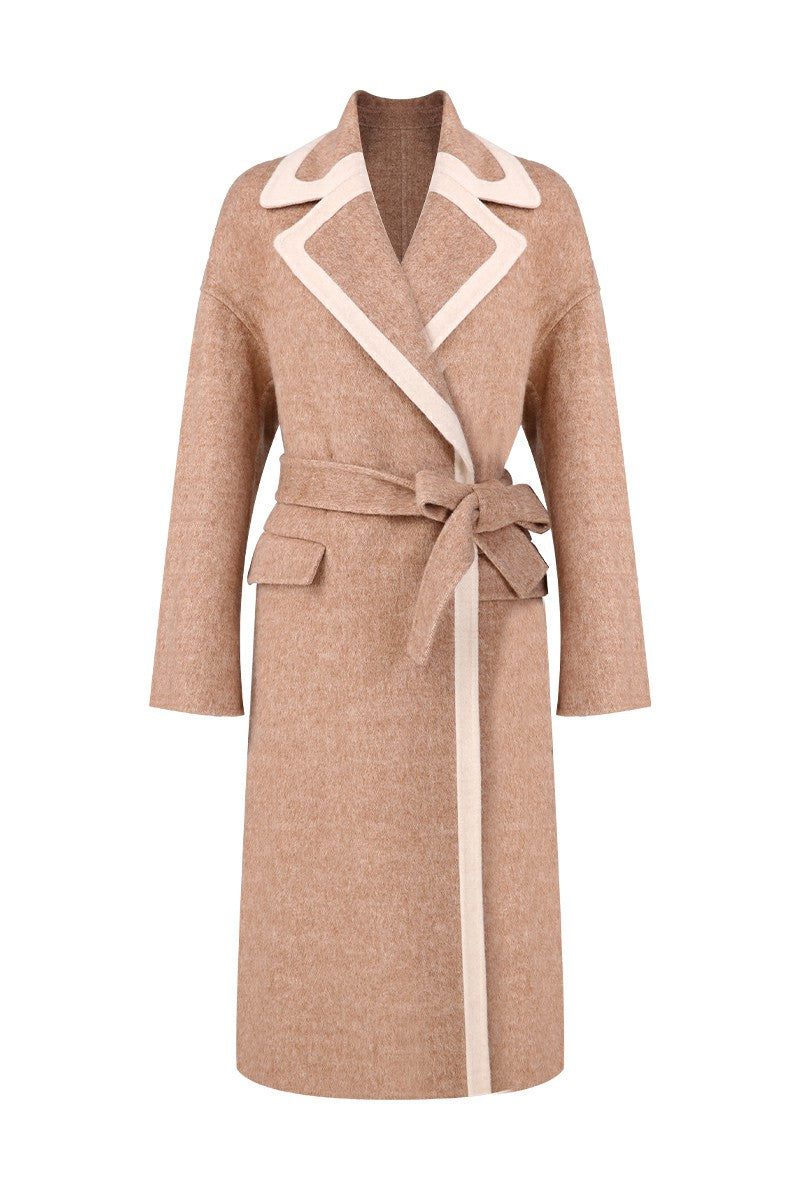 Beige coat with white accents on a white background