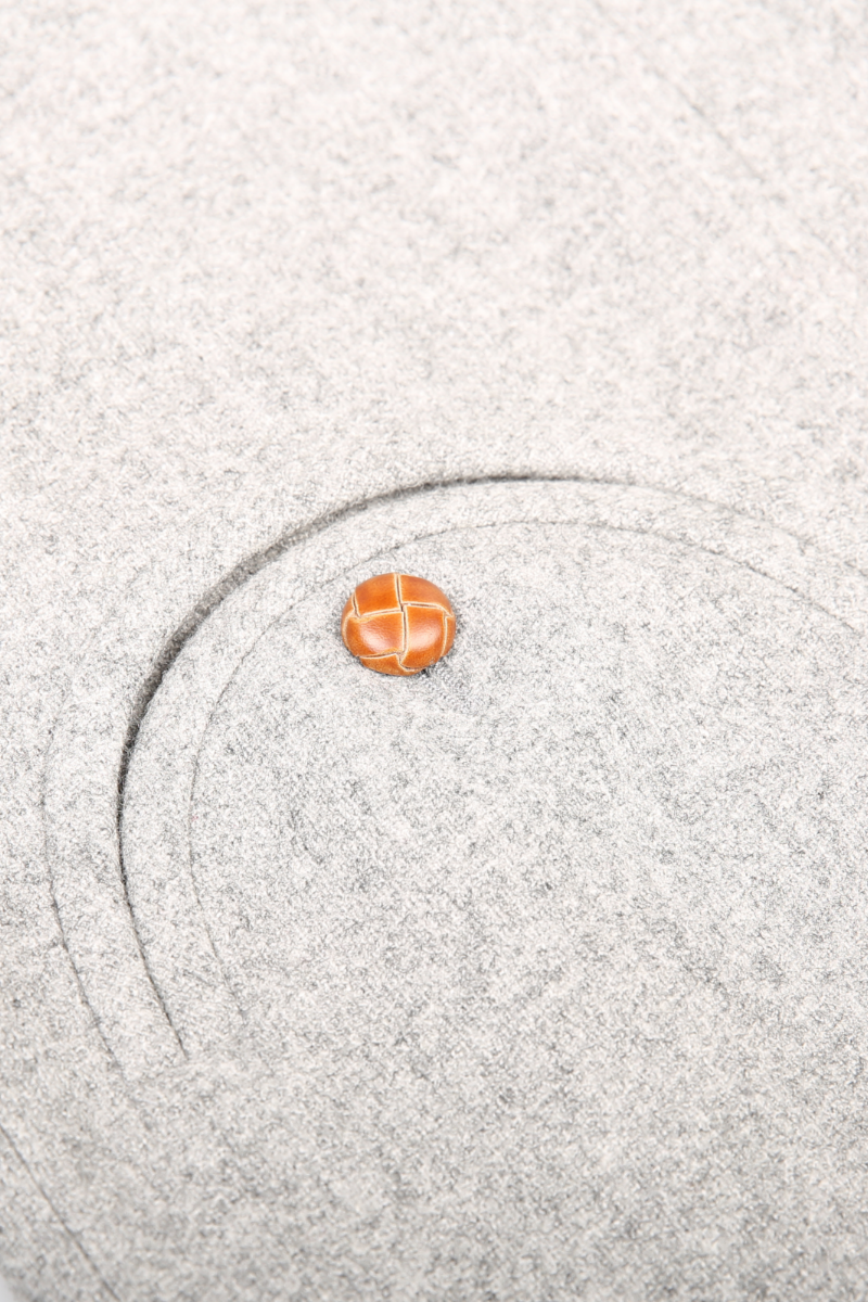 Small orange ball on a textured gray surface