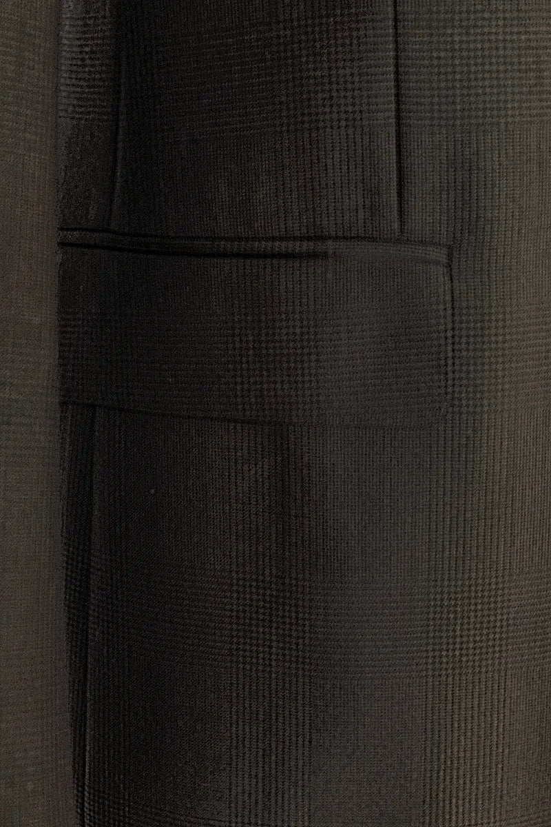 Close-up of a textured dark brown fabric with a subtle pattern