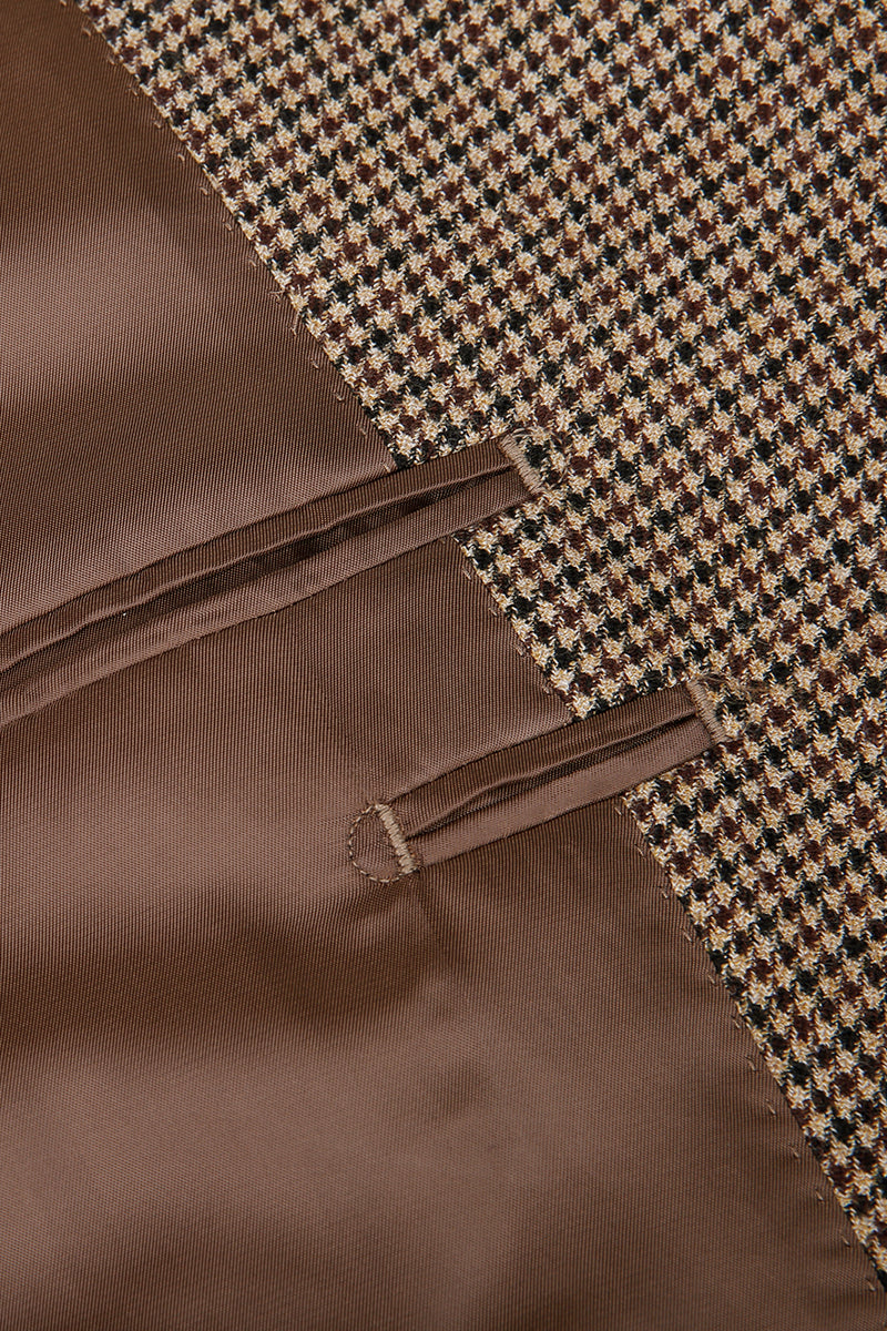 Close-up of brown fabric with a houndstooth pattern